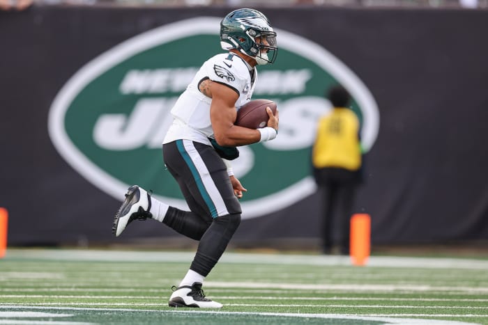 Philadelphia Eagles quarterback Jalen Hurts runs with the football.